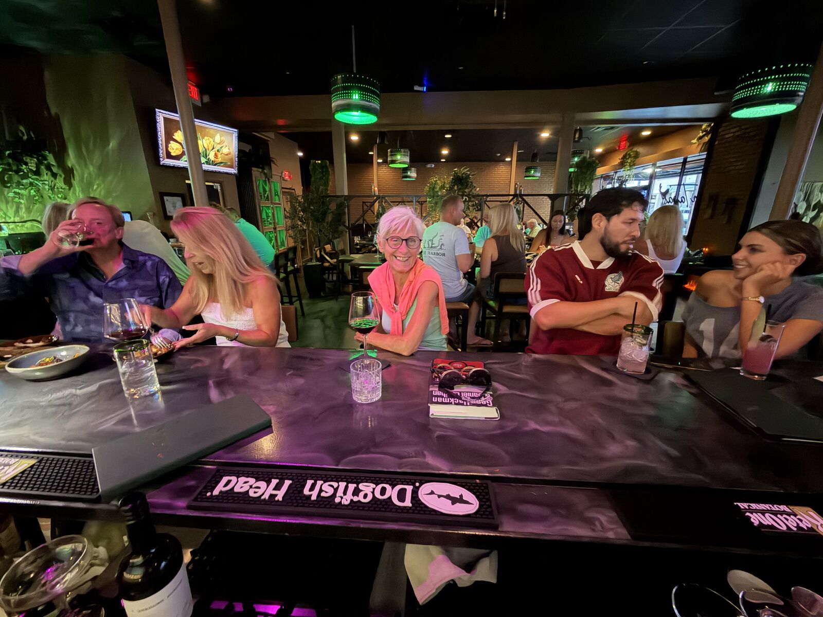 Guests enjoying the bar at night